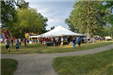 People at Event with Bounce House and Tent