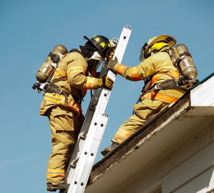 Firefighter Climbing Ladder